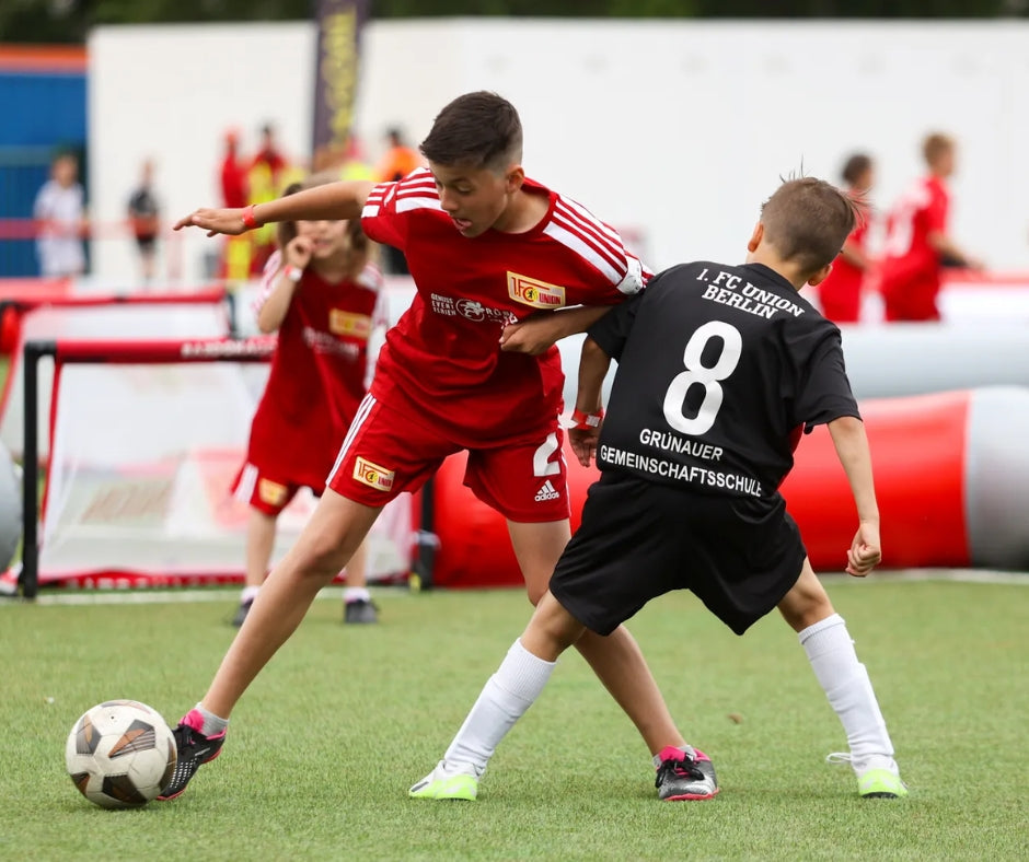 fc union academy players playing 3v3 football in an airpitch inflatable football pitch