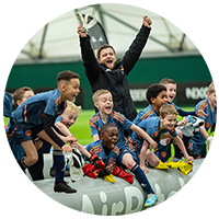 Kids celebrating while playing small-sided football on AirPitch inflatable pitch in Manchester United Tournament
