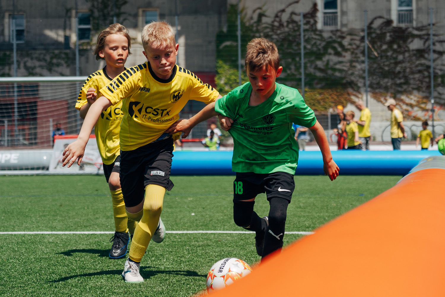 Young Football Players playing inside the AirPitch Inflatable Football Pitch in a 3v3 Tournament Germany