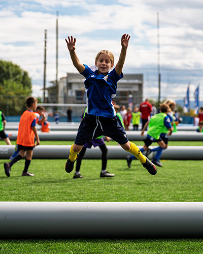 football soccer girl celebrating on 3v3 airpitch inflatable football pitch