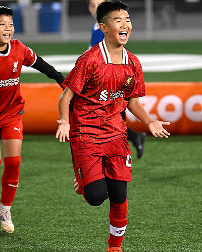 Liverpool Children celebrating a goal on the AirPitch inflatable football pitch during a grassroots 3v3 tournament