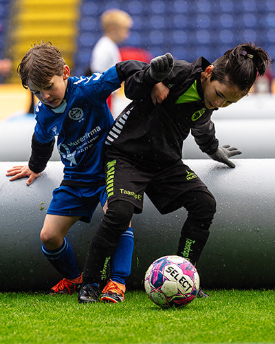 players playing inside a 3v3 Airpitch inflatable football pitch match in denmark